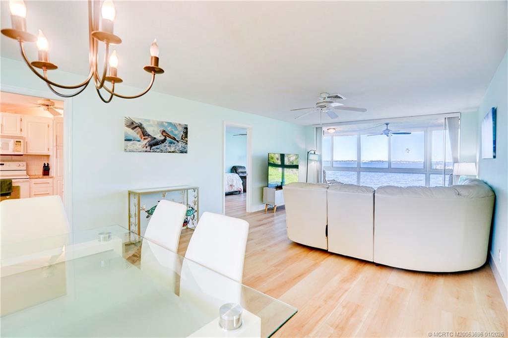 2370 Northeast Ocean Boulevard, Unit C205 Stuart, FL 34996 - Photo 11 of 80 a living room with furniture and a wooden floor