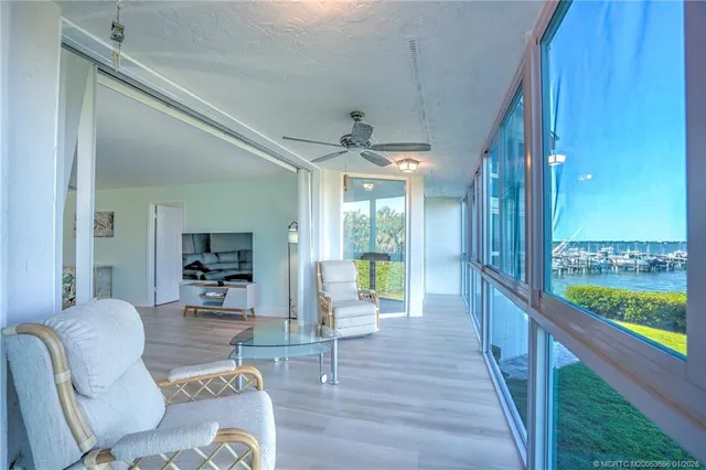 a bathroom with a granite countertop sink a toilet and a shower