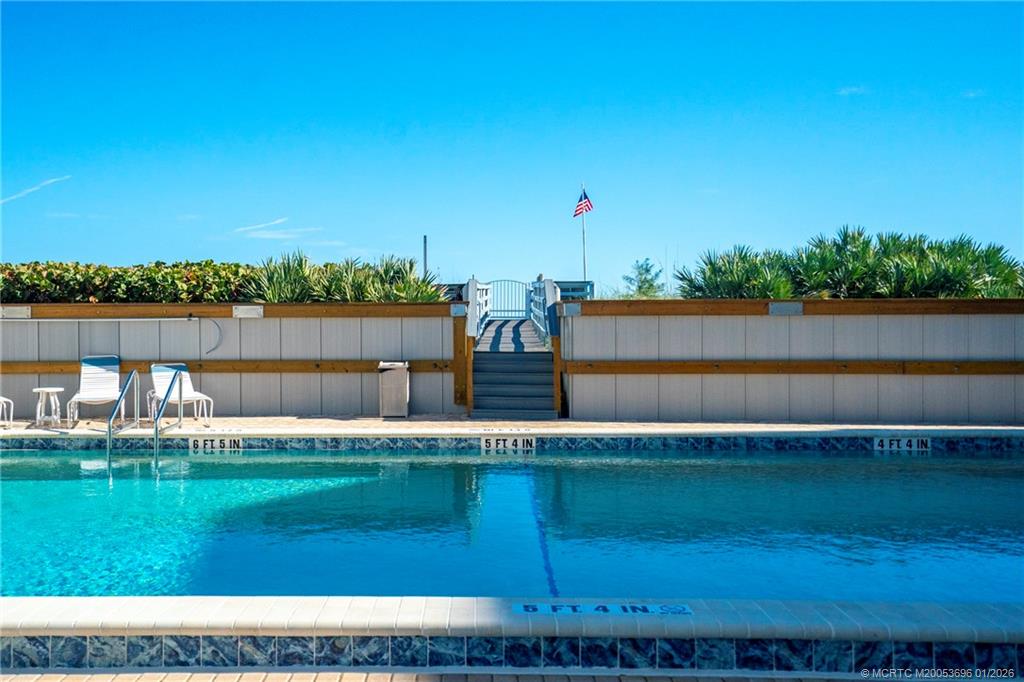 2370 Northeast Ocean Boulevard, Unit C205 Stuart, FL 34996 - Photo 24 of 80 a view of a lake with houses in the back