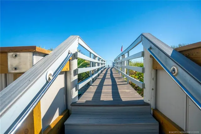 a living room with furniture gym equipment and a flat screen tv