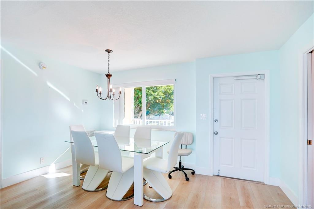 2370 Northeast Ocean Boulevard, Unit C205 Stuart, FL 34996 - Photo 37 of 80 a view of a dining room with furniture window and outside view