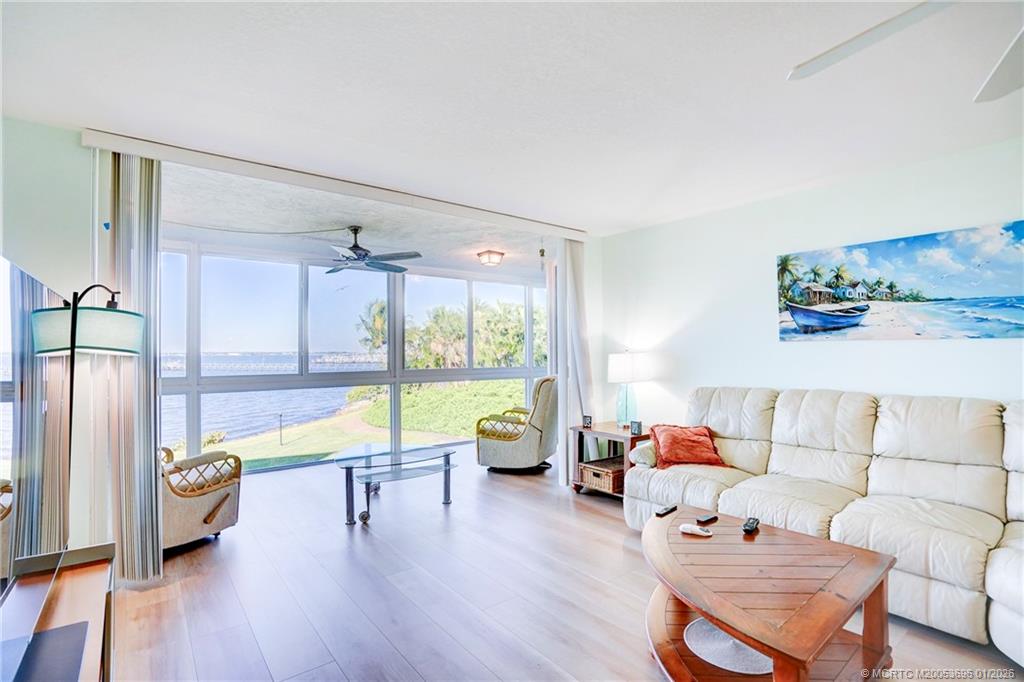 2370 Northeast Ocean Boulevard, Unit C205 Stuart, FL 34996 - Photo 40 of 80 a living room with furniture and a large window