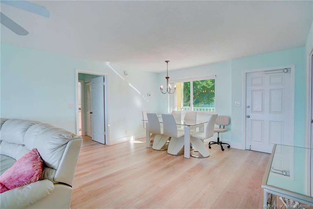 2370 Northeast Ocean Boulevard, Unit C205 Stuart, FL 34996 - Photo 41 of 80 a living room with furniture and a large window