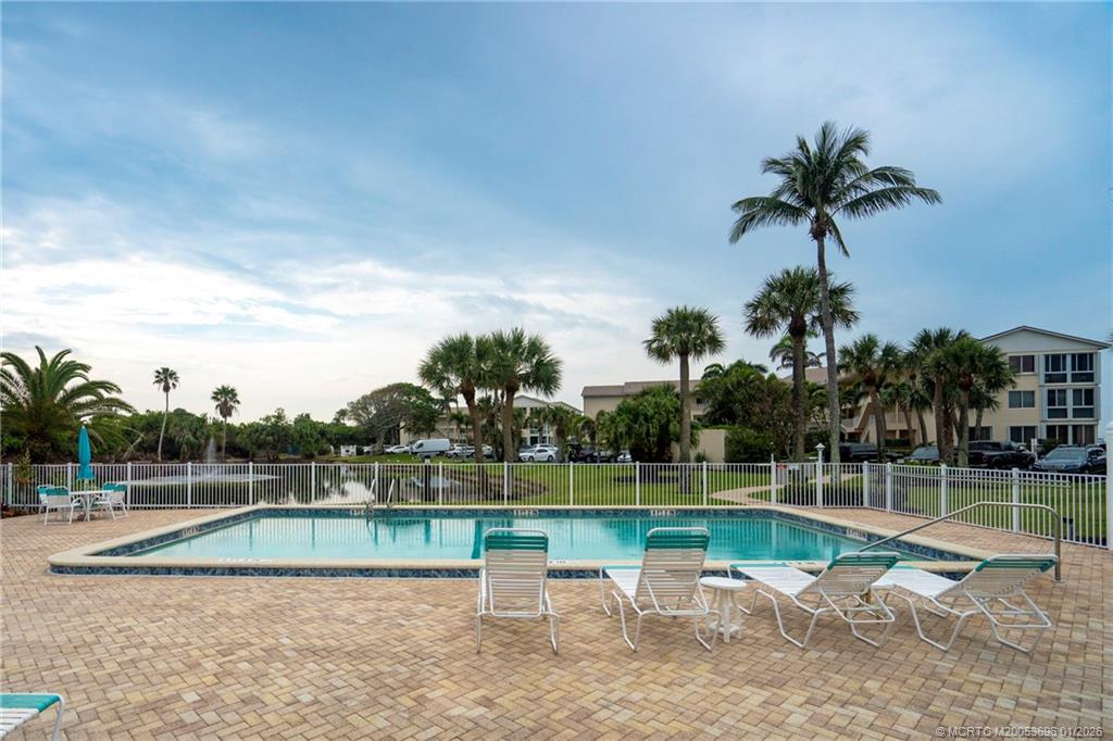 2370 Northeast Ocean Boulevard, Unit C205 Stuart, FL 34996 - Photo 64 of 80 a view of a yard with a swimming pool