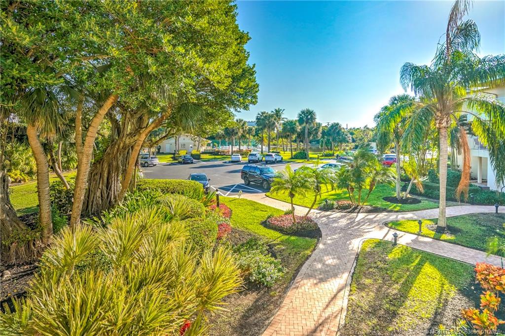 2370 Northeast Ocean Boulevard, Unit C205 Stuart, FL 34996 - Photo 7 of 80 a view of a swimming pool with lounge chair
