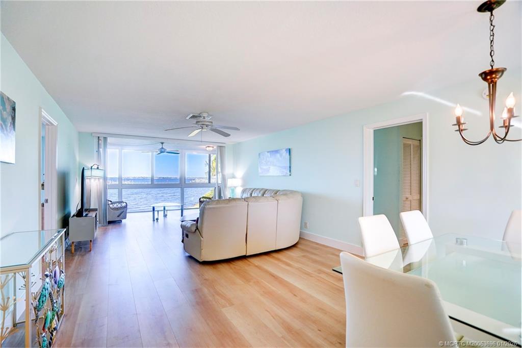 2370 Northeast Ocean Boulevard, Unit C205 Stuart, FL 34996 - Photo 10 of 80 a living room with furniture and a wooden floor