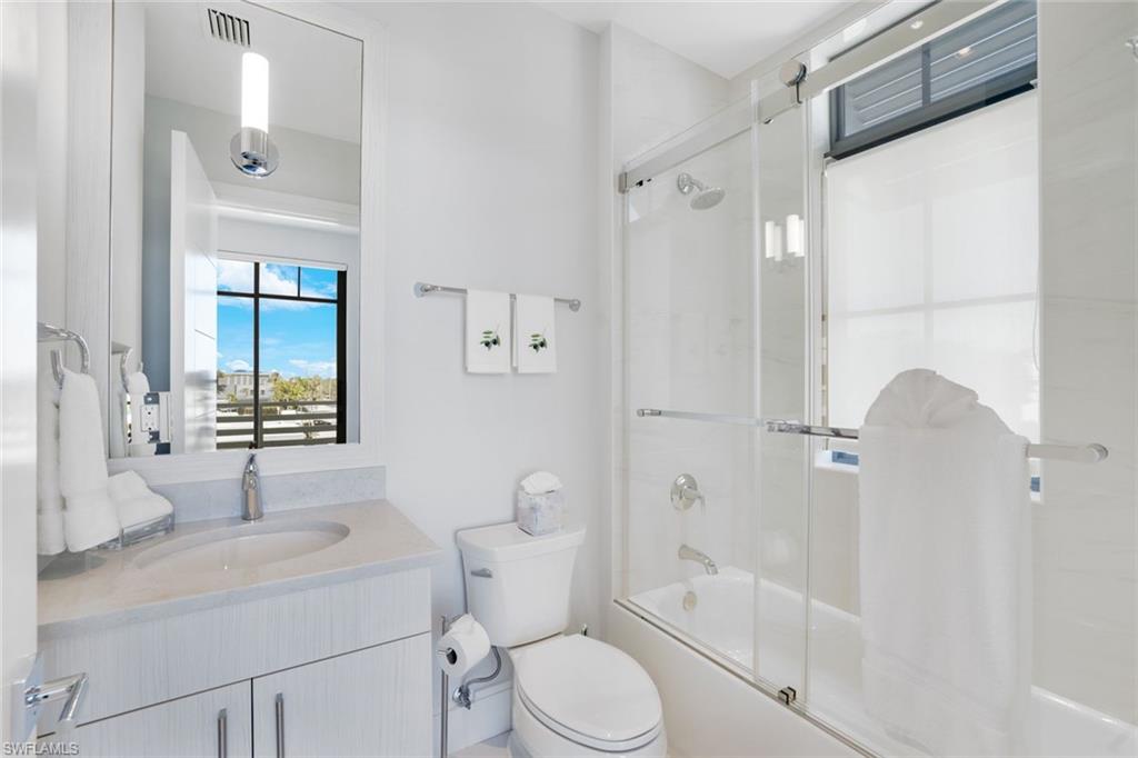 101 8th Street South, Unit 301 Naples, FL 34102 - Photo 16 of 17 a bathroom with a sink toilet and shower
