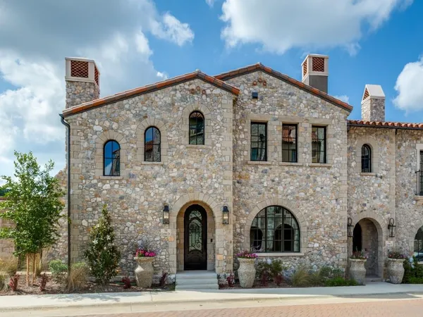 a front view of a house with parking space