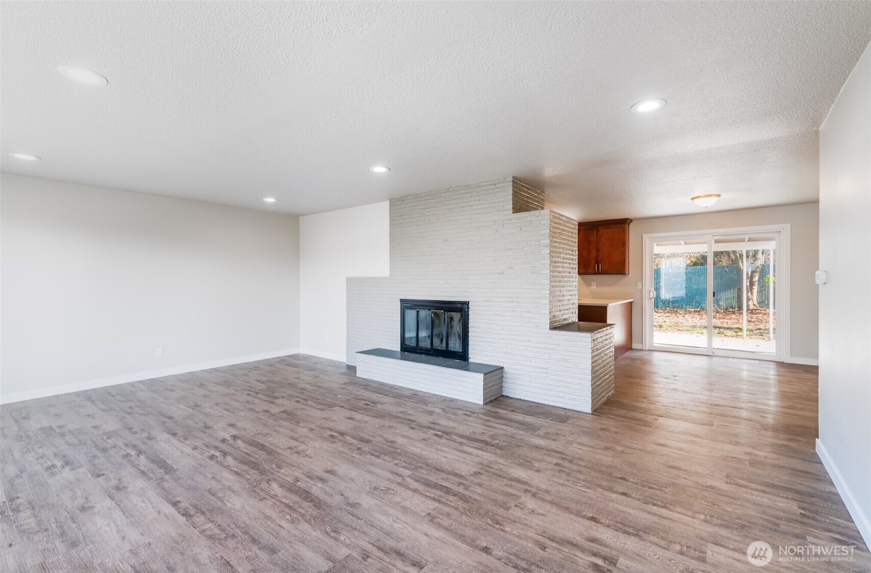 6235 A Street Tacoma, WA 98408 - Photo 4 of 12 a view of empty room with wooden floor and fireplace