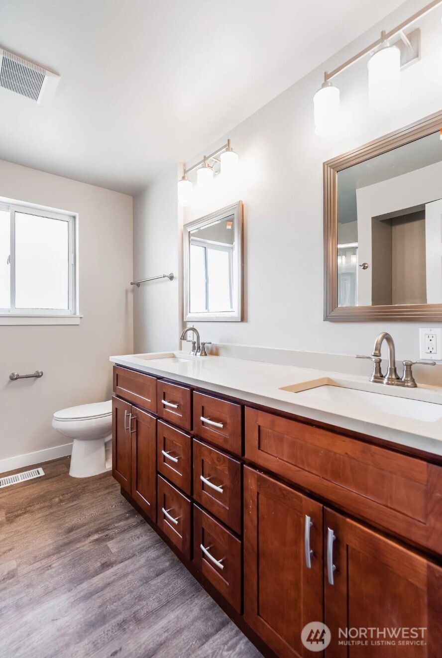 6235 A Street Tacoma, WA 98408 - Photo 7 of 12 a spacious bathroom with double vanity two mirror and a bathtub