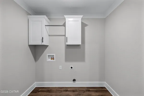 a bathroom with a bathtub shower sink vanity mirror and toilet