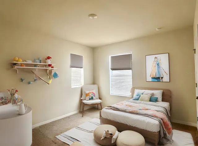 a bedroom with a bed and glass window