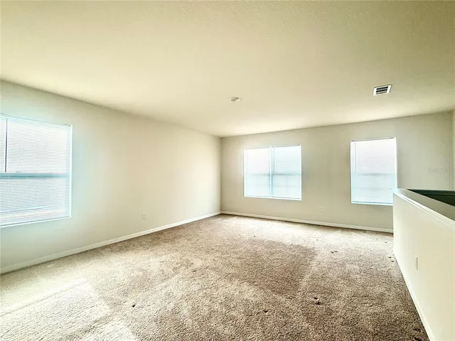 a view of house with backyard