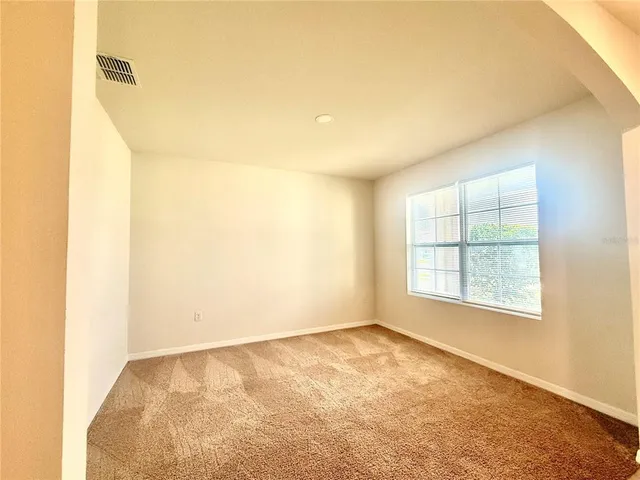 a kitchen with granite countertop a sink a counter top space appliances and cabinets