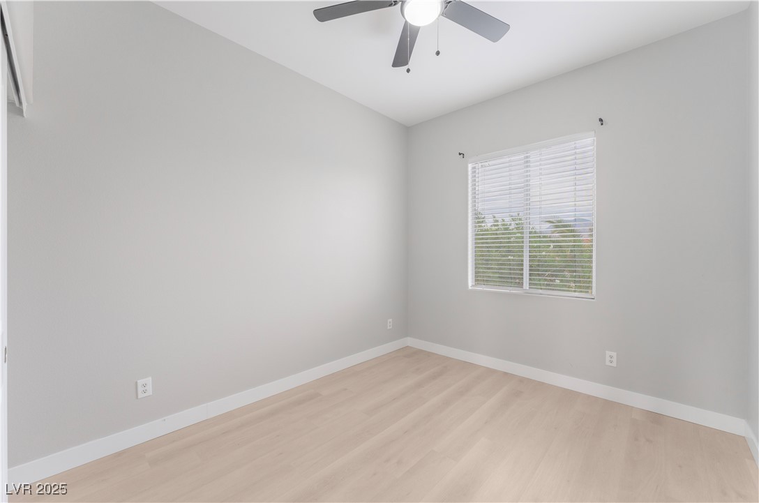 3695 Funston Way Las Vegas, NV 89129 - Photo 38 of 43 Unfurnished room featuring light wood-style floors and a ceiling fan
