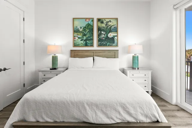 a living room with lots of furniture and a floor to ceiling window