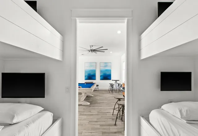 a view of roof deck with wooden floor and fence