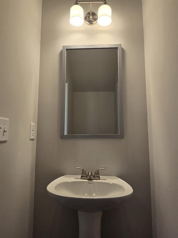 6198 Ripple Way, Unit 87 Atlanta, GA 30349 - Photo 11 of 23 a bathroom with a sink and a mirror