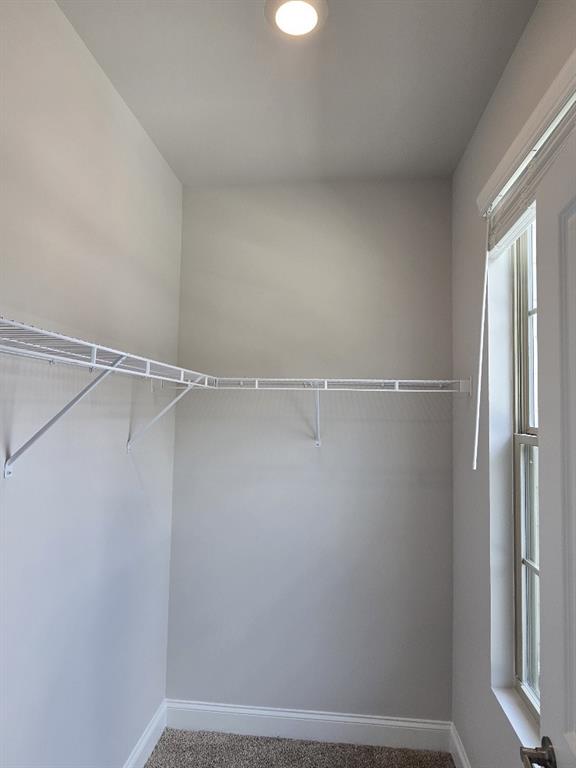 6198 Ripple Way, Unit 87 Atlanta, GA 30349 - Photo 18 of 23 a view of a room with racks on the wall