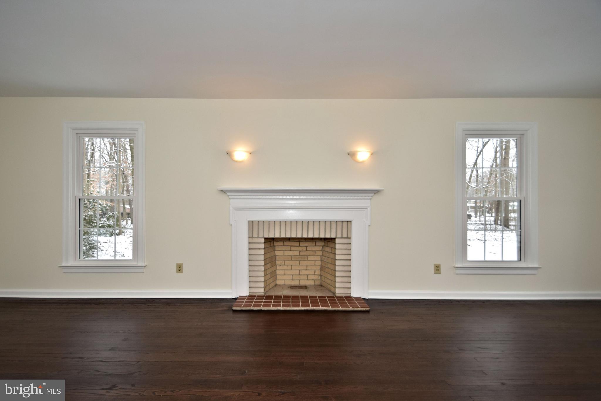404 Sunset Road Burlington, NJ 08016 - Photo 27 of 72 Living Room fireplace with wall sconces