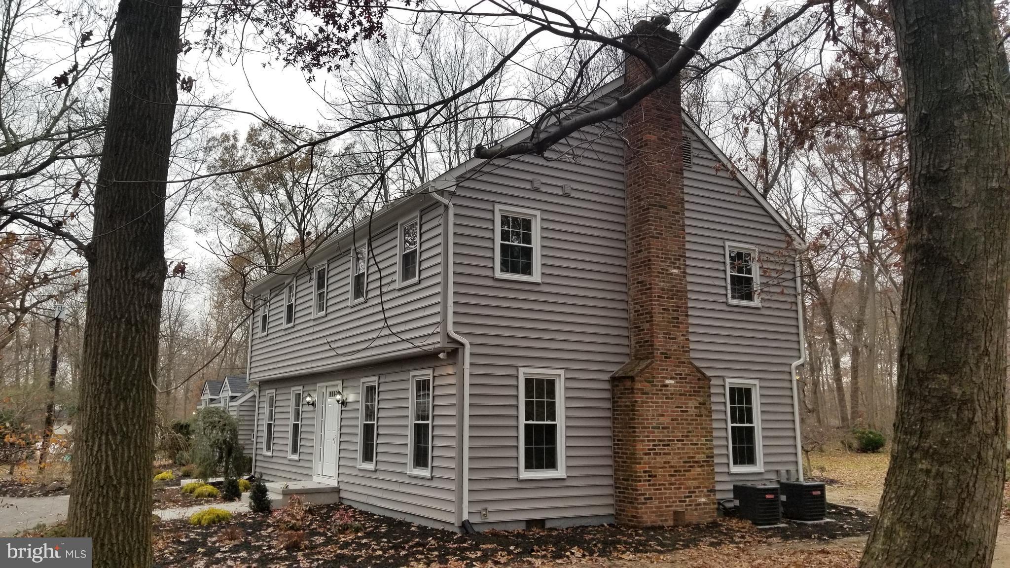 404 Sunset Road Burlington, NJ 08016 - Photo 62 of 72 Side facade with exterior of chimney