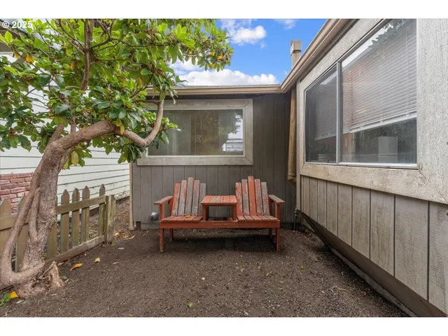 a view of house with backyard