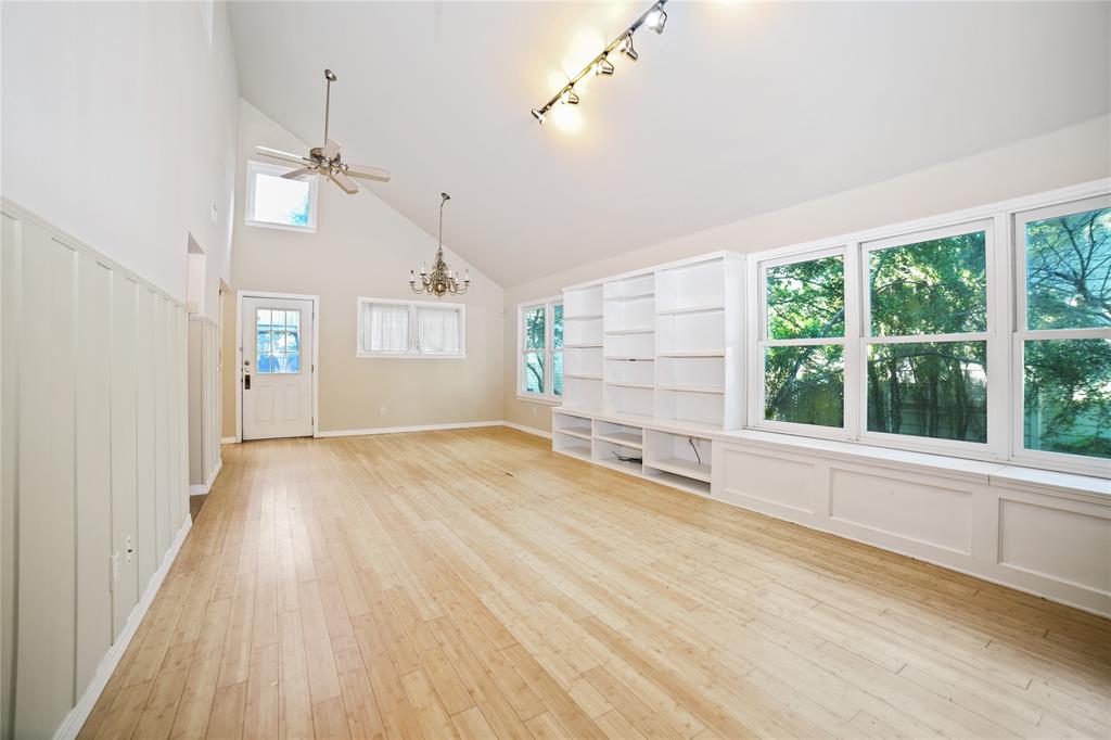 2716 East 22nd Street, Unit A Austin, TX 78722 - Photo 2 of 11 an empty room with wooden floor and windows