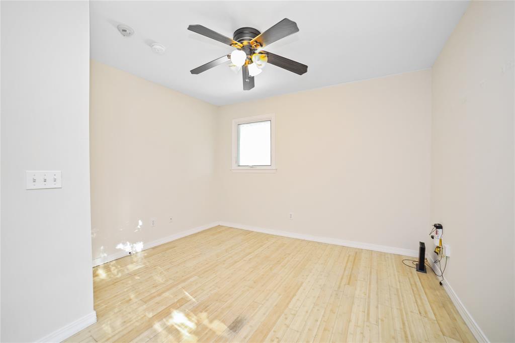 2716 East 22nd Street, Unit A Austin, TX 78722 - Photo 5 of 11 a view of empty room with wooden floor