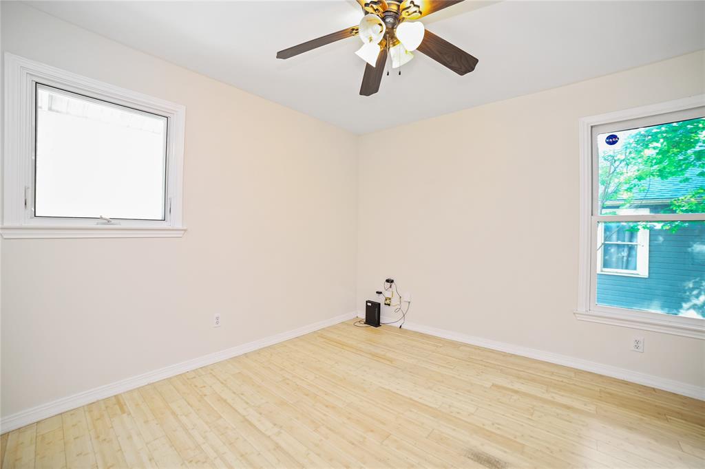 2716 East 22nd Street, Unit A Austin, TX 78722 - Photo 6 of 11 a view of a room with a window and wooden floor