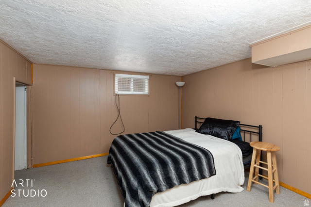 875 Patterson Street Ogden, UT 84403 - Photo 21 of 38 Bedroom with carpet and a textured ceiling