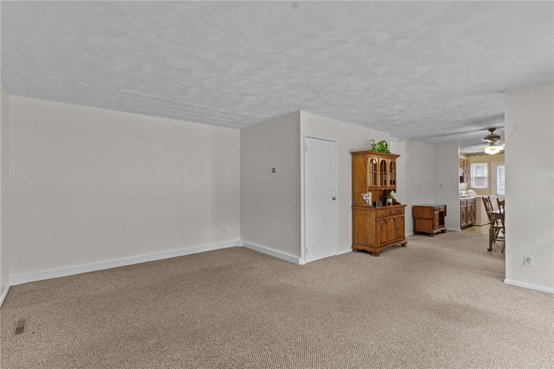 25 Town Farm Road Coventry, RI 02816 - Photo 5 of 31 Lots of space to relax or entertain in this living room and dining room area!