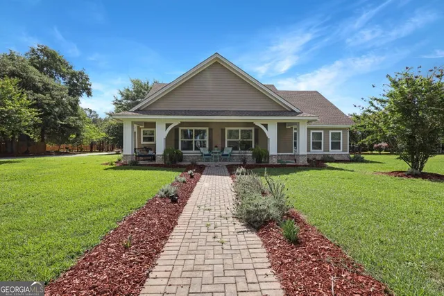 a front view of a house with a yard
