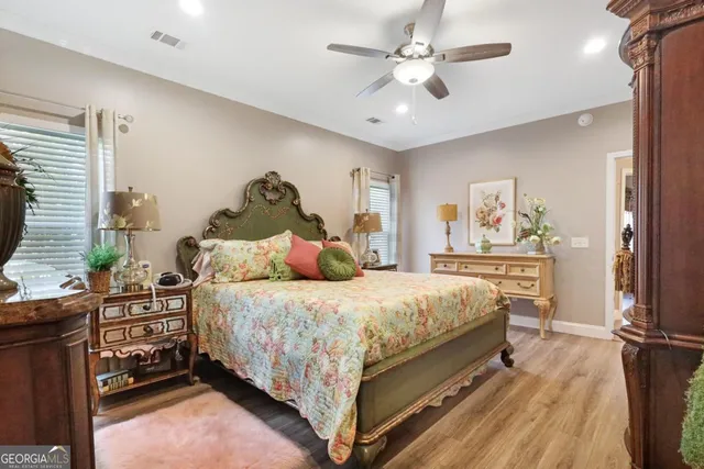 a bed room with a bed and a chandelier