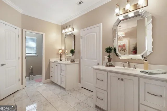 a spacious bathroom with a double vanity sink mirror and