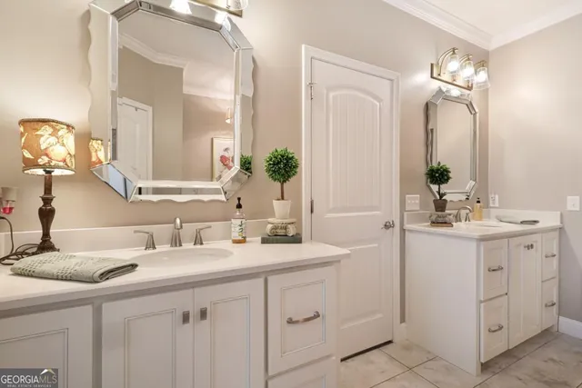 a bathroom with a double vanity sink and a mirror