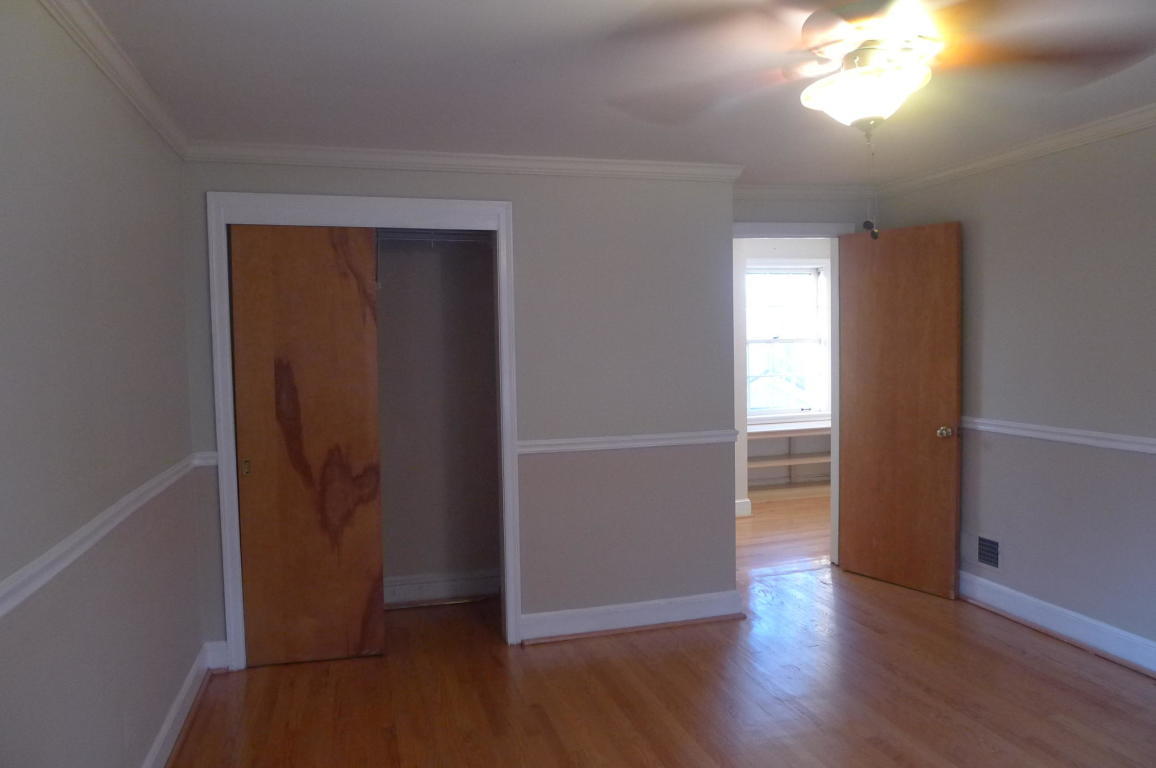3125 Stoneridge Road Southwest Roanoke, VA 24014 - Photo 14 of 28 an empty room with wooden floor and windows