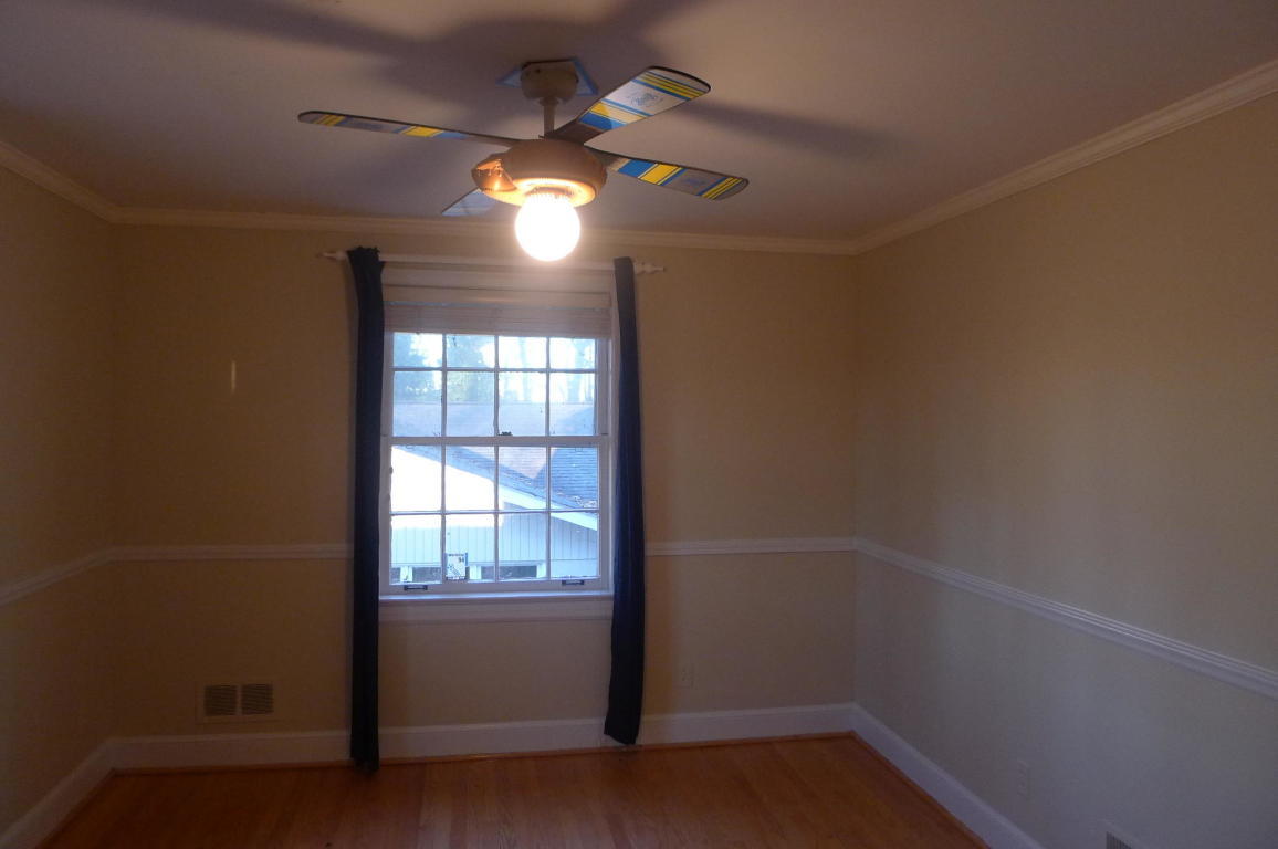 3125 Stoneridge Road Southwest Roanoke, VA 24014 - Photo 15 of 28 an empty room with wooden floor and windows