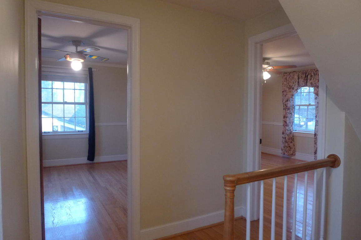 3125 Stoneridge Road Southwest Roanoke, VA 24014 - Photo 16 of 28 a view of hallway with window and wooden floor