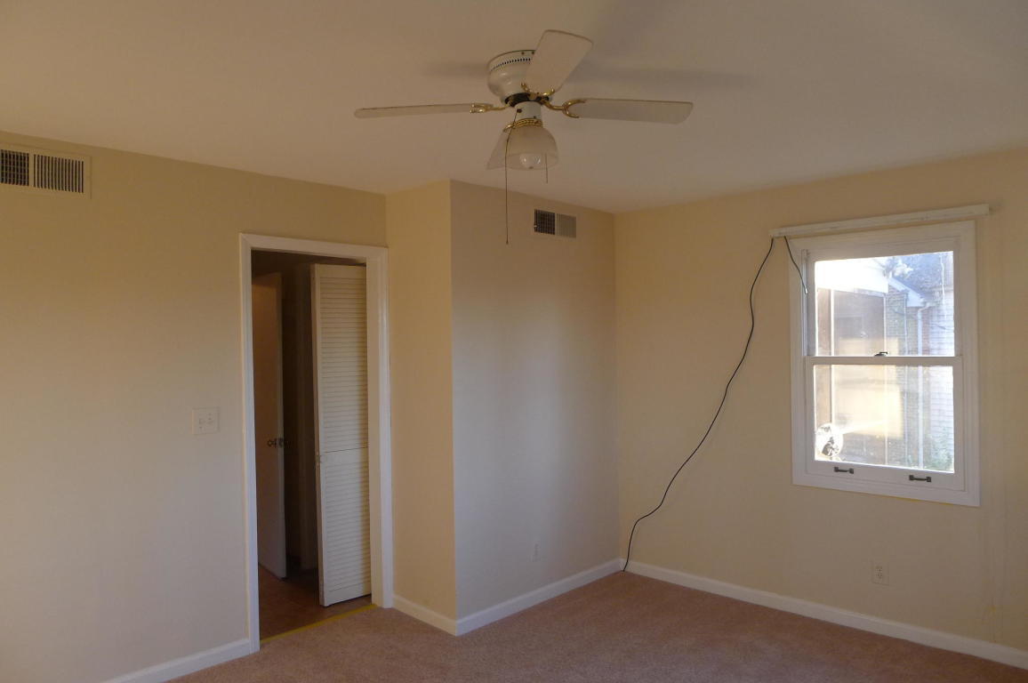3125 Stoneridge Road Southwest Roanoke, VA 24014 - Photo 19 of 28 an empty room with a window and a fan