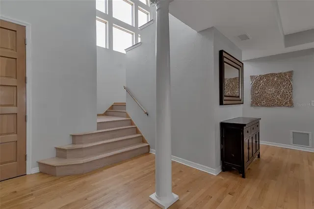 a kitchen with kitchen island granite countertop a sink stove and refrigerator