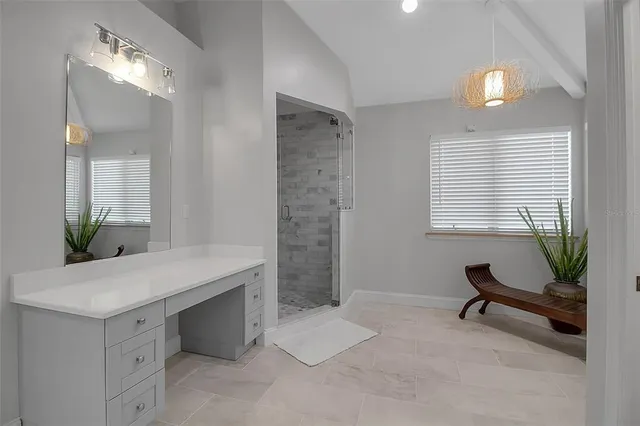 an empty room with a window and a ceiling fan