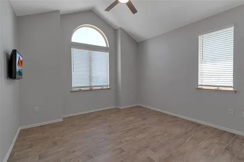 a view of a livingroom with furniture and staircase