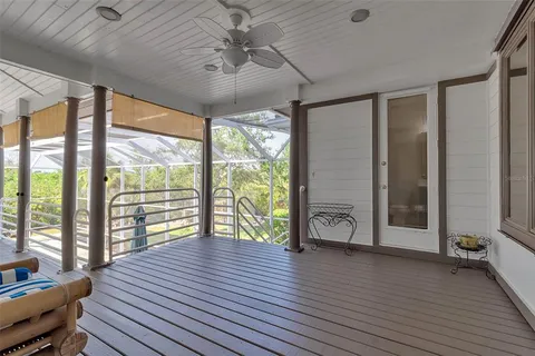 a view of a patio with a dining table and chairs