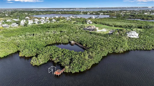 an aerial view of a house with garden space and outdoor seating