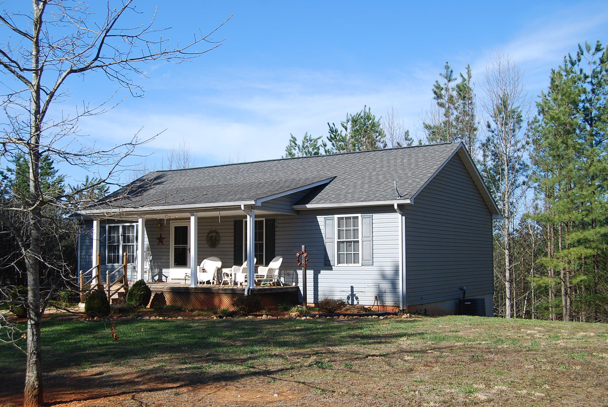 736 Holland Road Callaway, VA 24067 - Photo 2 of 45 a front view of a house with a garden