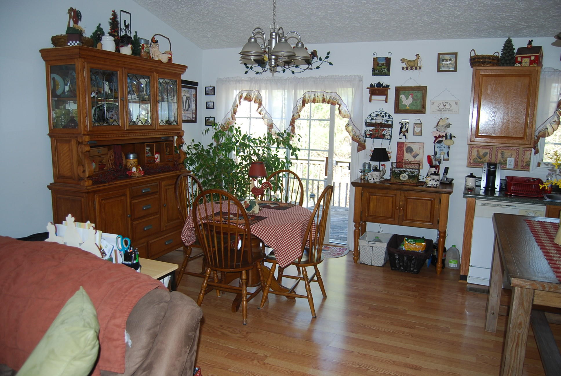 736 Holland Road Callaway, VA 24067 - Photo 13 of 45 a view of a dining room with furniture and chandelier