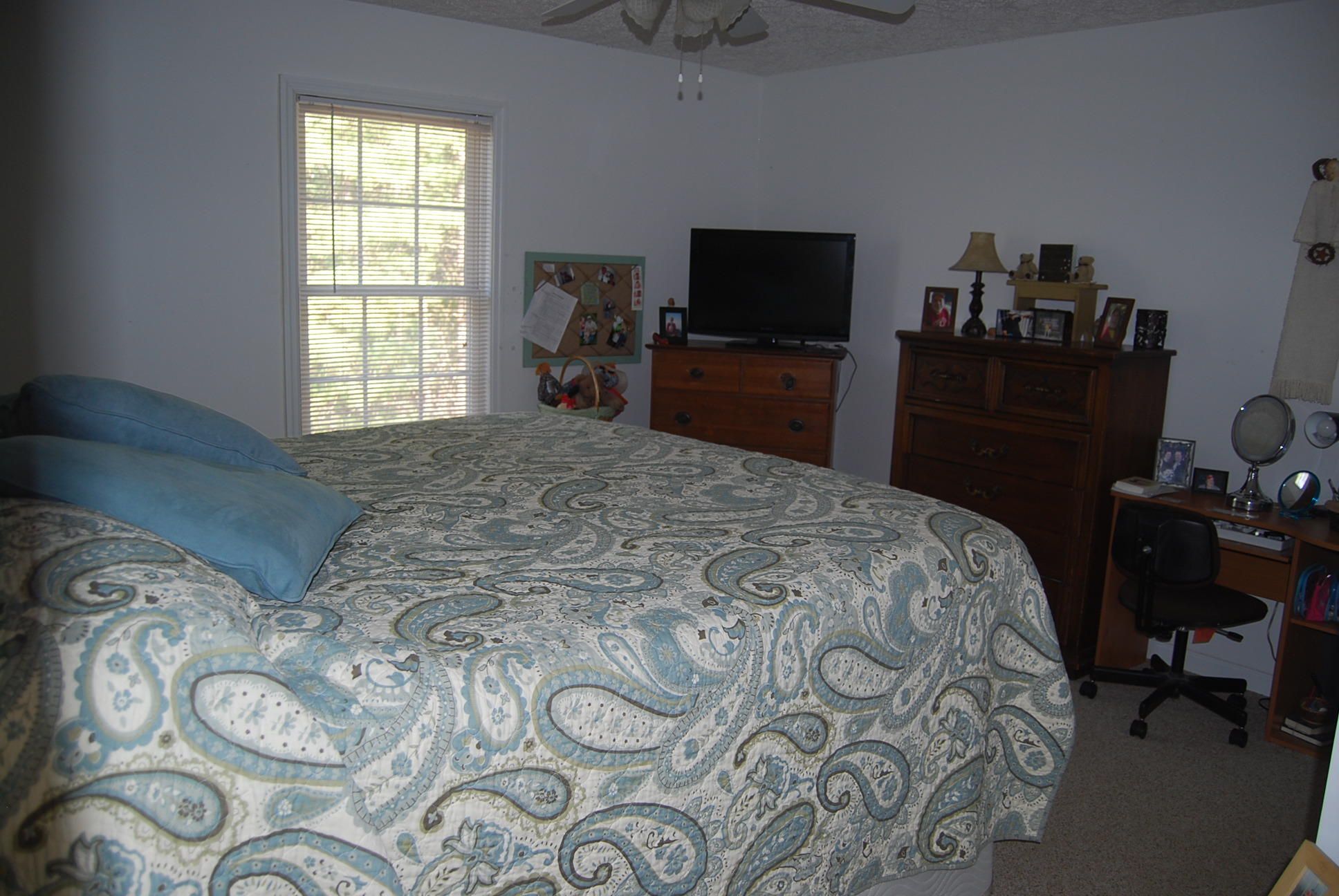 736 Holland Road Callaway, VA 24067 - Photo 18 of 45 a bedroom with a bed and a flat tv screen on the dresser