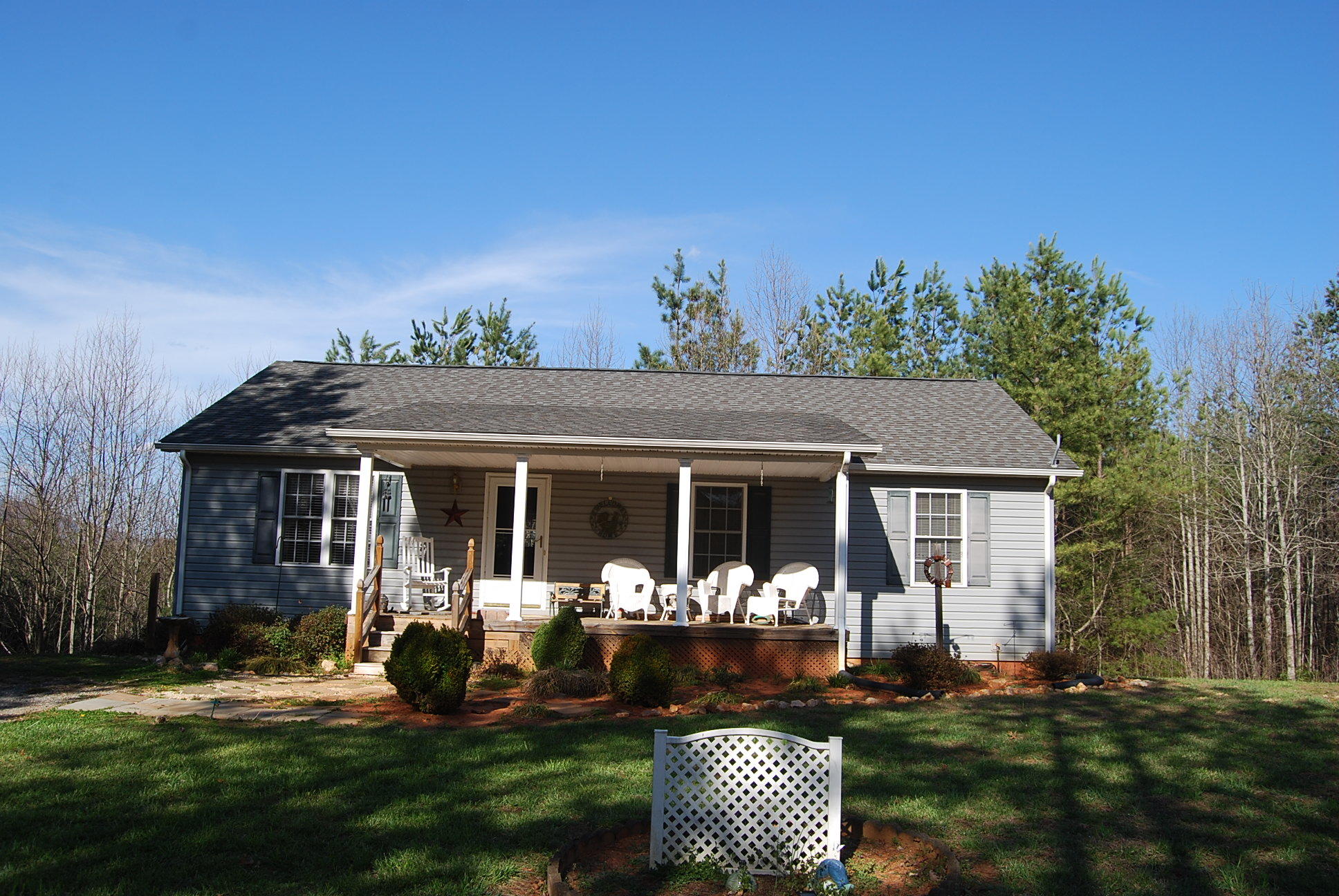 736 Holland Road Callaway, VA 24067 - Photo 3 of 45 a front view of house with a garden and patio