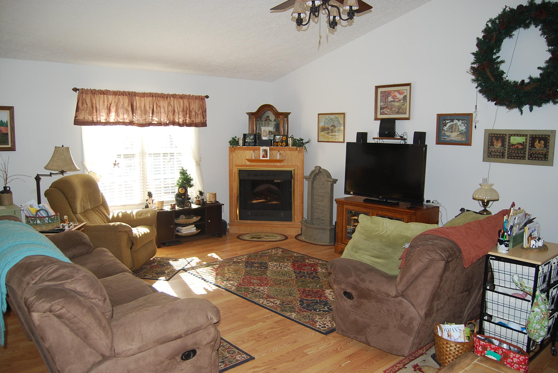 736 Holland Road Callaway, VA 24067 - Photo 4 of 45 a living room with furniture a flat screen tv and a fireplace