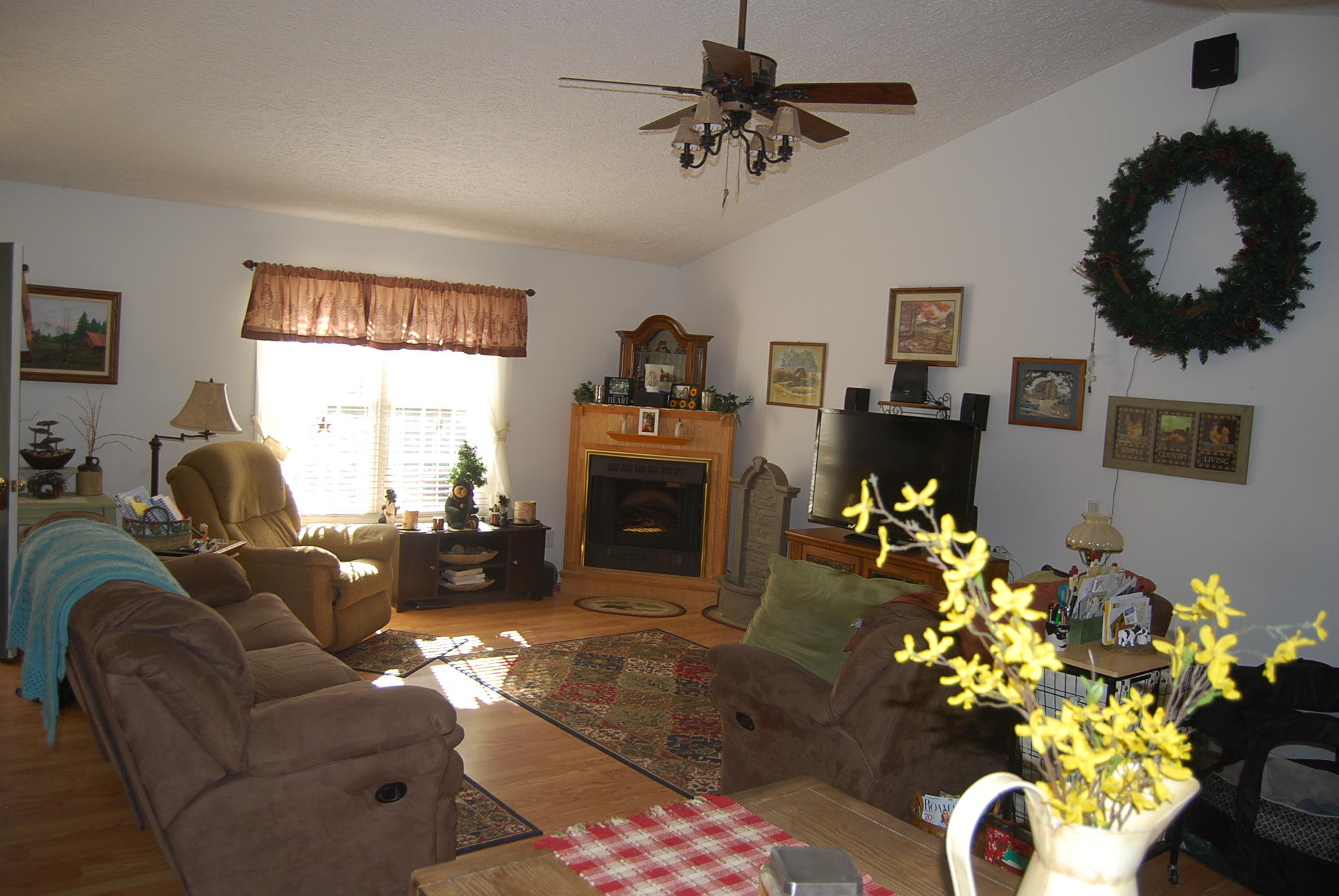 736 Holland Road Callaway, VA 24067 - Photo 5 of 45 a living room with furniture chandelier and a fireplace